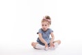 Childhood, emotions concept, little cute girl in a blue dress posing in the studio on a white Royalty Free Stock Photo