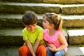 Childhood first love. summer holiday vacation. small girl and boy on stair. Relations. couple of little children. Boy Royalty Free Stock Photo