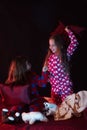 Childhood and fun concept. Children have pajama party