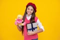 childhood happiness. boxing day. kid in beret with toy. smiling child has birthday.