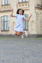 childhood happiness of cheerful teen girl jumping outside. photo of childhood happiness Royalty Free Stock Photo