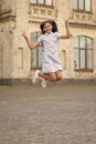 childhood happiness of cheerful teen girl jumping outside. photo of childhood happiness Royalty Free Stock Photo