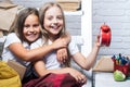 Childhood and happiness concept. Happy children of happy little girls with clock at school classroom. Private school