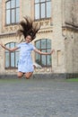 childhood happiness of glad teen girl outdoor. childhood happiness of teen girl jumping outside Royalty Free Stock Photo