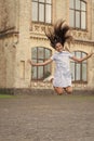 childhood happiness of glad teen girl outdoor. childhood happiness of teen girl jumping outside Royalty Free Stock Photo