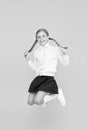 Childhood happiness. Kid cute student. Schoolgirl excellent pupil jump mid air. Schoolgirl tidy appearance school Royalty Free Stock Photo