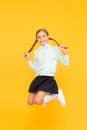 Childhood happiness. Kid cute student. Schoolgirl excellent pupil jump mid air. Schoolgirl tidy appearance school