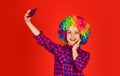 Childhood happiness. kid looking funny in rainbow wig hair. hair dyeing at hairdresser. child having fun. happy birthday Royalty Free Stock Photo