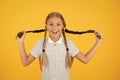 Childhood happiness. little girls in school uniform. retro look. children in vintage style play with pigtails. old