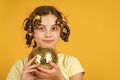 childhood happiness. retro disco party. Young pin-up girl with curlers and disco ball. Little cute girl ready for party Royalty Free Stock Photo