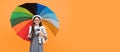 childhood happiness. teen child under colorful parasol. kid in beret with rainbow umbrella. Royalty Free Stock Photo