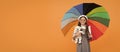 childhood happiness. teen child under colorful parasol. kid in beret with rainbow umbrella.