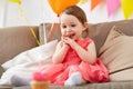 Happy baby girl looking at birthday cupcake Royalty Free Stock Photo