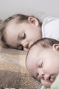 Childhood, infancy, family, sleep, rest, love concept - black white close up of two children, newborn baby and girl Royalty Free Stock Photo