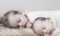 Childhood, infancy, family, sleep, rest, love concept - black white close up two children, newborn baby and girl Royalty Free Stock Photo