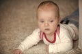Childhood, infancy, newborn. Infant crawl on floor carpet. Innocence, beauty, purity Royalty Free Stock Photo