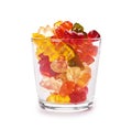 Childhood and jelly bears candies in glass cup isolated on white background