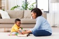 Mother and baby playing with toy blocks at home Royalty Free Stock Photo