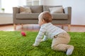 Baby boy crawling on floor at home Royalty Free Stock Photo