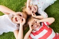 Happy little kids looking through finger glasses