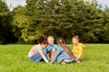 happy children playing round dance at park