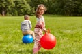 happy children bouncing on hopper balls at park Royalty Free Stock Photo