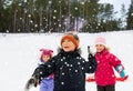 happy little kids playing snowball fight in winter Royalty Free Stock Photo