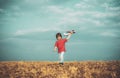 Childhood memories - beautiful sky over meadow. Childhood dream imagination concept. Active child playing. Child playing Royalty Free Stock Photo