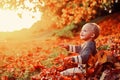 Childhood memories. Child autumn leaves background. Warm moments of autumn. Toddler boy blue eyes enjoy autumn. Small Royalty Free Stock Photo