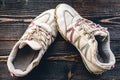 Childhood symbol - pair of vintage used teenage sneakers