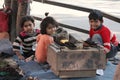 Children sitting on the seat of a shoe maker, Childhood mood of children, street photography, 