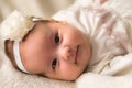 Childhood, motherhood, emotions, fashion concepts - Cute smiling happy chubby baby close up little girl in beautiful Royalty Free Stock Photo