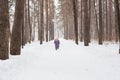 Childhood, nature and winter concept - Funny laughing toddler girl running in a beautiful snowy park Royalty Free Stock Photo