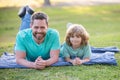 Childhood and parenthood kids concept. Happy father and son playing together outdoor. Royalty Free Stock Photo