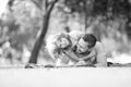 Childhood and parenthood kids concept. Happy father and son playing together outdoor. Royalty Free Stock Photo