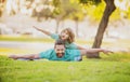 Childhood and parenthood kids concept. Happy father and son playing together outdoor. Concept of friendly family. Royalty Free Stock Photo