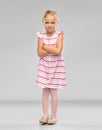 Displeased little girl with crossed arms pouting Royalty Free Stock Photo