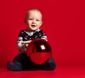 Childhood and people concept - happy little baby boy with ball Royalty Free Stock Photo