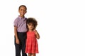 Childhood and people concept-two cheerful african-american siblings over white background with copy space