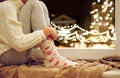 Close up of girl sitting at window on christmas Royalty Free Stock Photo