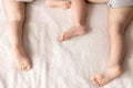 Childhood, sleep, relaxation, family, lifestyle concept - Feet of sleeping children lying randomly carelessly against a Royalty Free Stock Photo