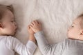 Childhood, sleep, relaxation, family, lifestyle concept - two young children 2 and 3 years old dressed in white and Royalty Free Stock Photo