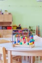 Childhood and socialization concept: Colorful wooden toy in the kindergarten