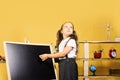 Childhood and study time concept. Schoolgirl with dreamy face Royalty Free Stock Photo