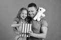 Childhood, surprise gift and family concept. Daughter and father hug Royalty Free Stock Photo