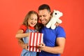 Childhood, surprise gift and family concept. Daughter and father hug Royalty Free Stock Photo