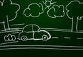 Childish car drawing on a green chalk board with road, clouds, trees and sun