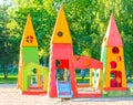 Childish playground in city park. Swing carousel in park for children. Children's playground bright multicolored Royalty Free Stock Photo