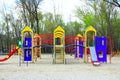 Childish playground in city park. Swing carousel in park for children Royalty Free Stock Photo