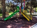 Childish playground in city park. Swing carousel in park for children Royalty Free Stock Photo